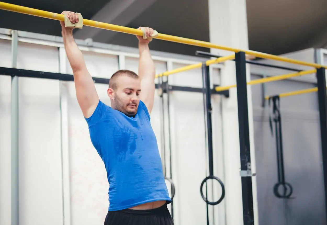 Free weight and bodyweight gym equipment like squat rack, pull-up bar, jump rope, and chest press machine.